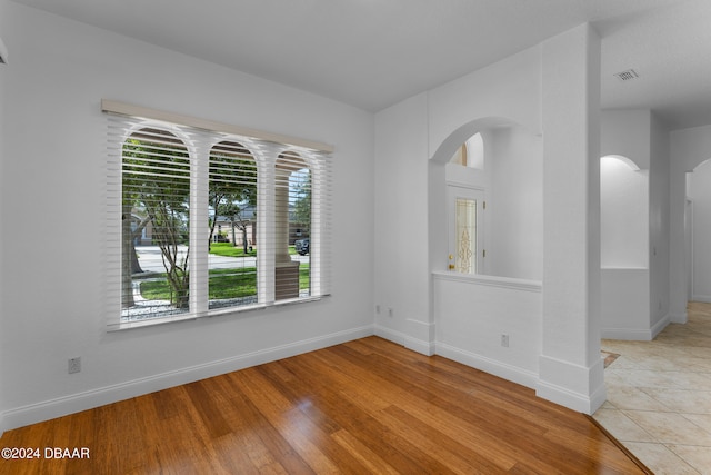 spare room with light hardwood / wood-style floors