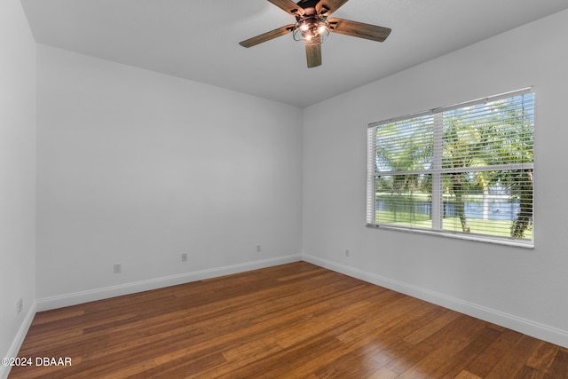 spare room featuring hardwood / wood-style floors and ceiling fan