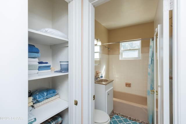 full bathroom with vanity, toilet, and shower / tub combo