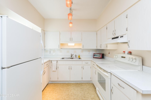 kitchen with sink, white appliances, hanging light fixtures, and white cabinets