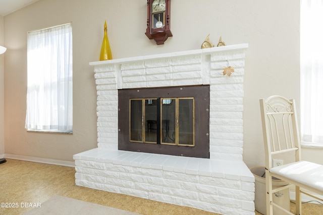 details with carpet flooring and a brick fireplace