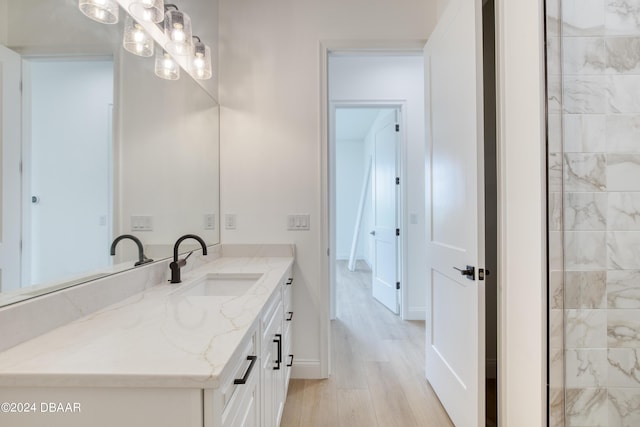 bathroom featuring hardwood / wood-style flooring and vanity