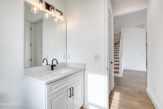 bathroom featuring hardwood / wood-style floors and vanity