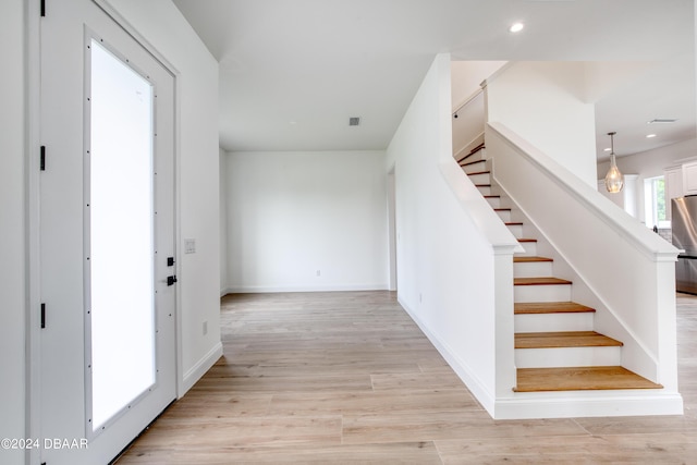 foyer with light wood-type flooring