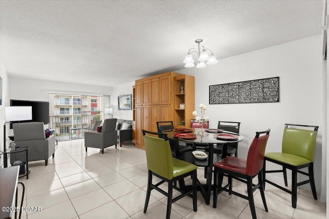 2711 N Halifax Ave Unit 372, Daytona Beach, FL 32118 - dining space with a chandelier, a textured ceiling, and light tile patterned floors