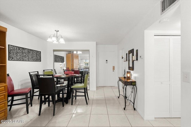 2711 N Halifax Ave Unit 372, Daytona Beach, FL 32118 - dining space with a chandelier and light tile patterned floors