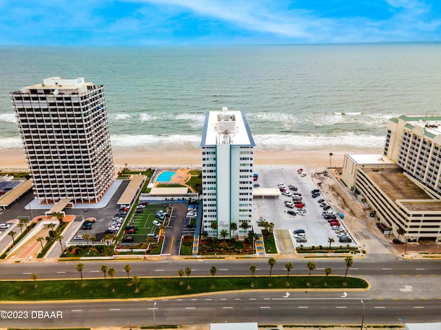 aerial view with a beach view and a water view