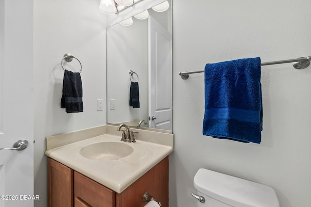 half bath with toilet and vanity