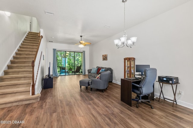 office featuring visible vents, ceiling fan with notable chandelier, baseboards, and wood finished floors