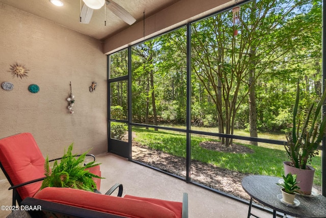 sunroom with a ceiling fan