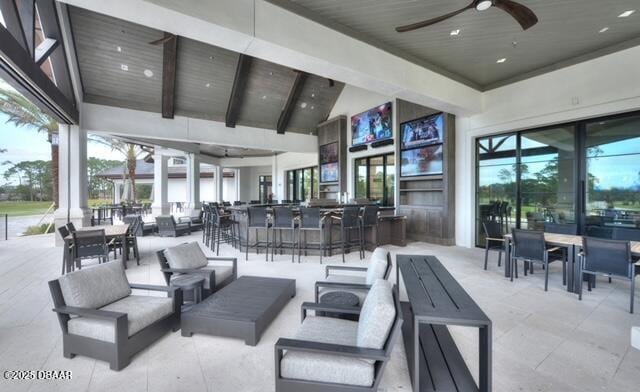 view of patio / terrace featuring outdoor dry bar, an outdoor hangout area, and a ceiling fan