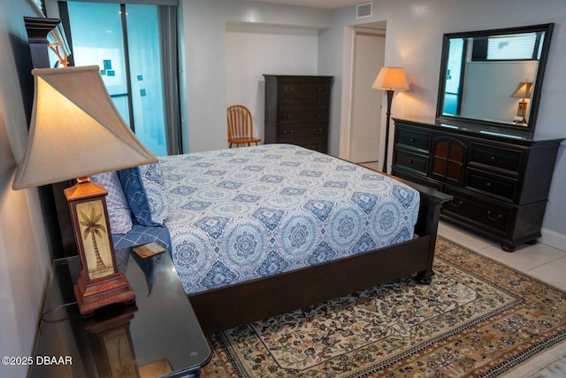 bedroom featuring light tile patterned flooring