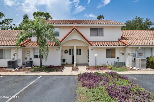 mediterranean / spanish-style house featuring central air condition unit