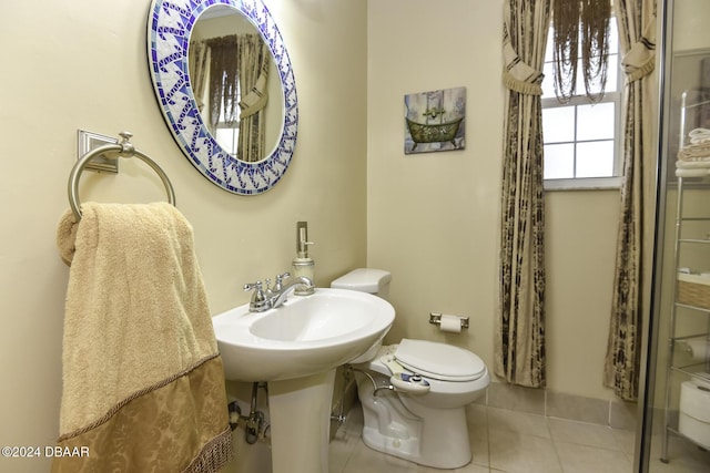 1199 N Halifax Ave, Daytona Beach, FL 32118 - bathroom featuring toilet and tile patterned flooring