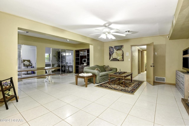 1199 N Halifax Ave, Daytona Beach, FL 32118 - living area with light tile patterned floors and a ceiling fan