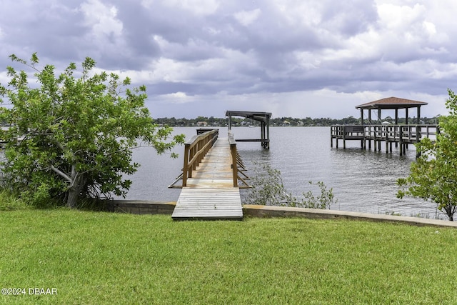 1199 N Halifax Ave, Daytona Beach, FL 32118 - dock featuring a water view and a lawn