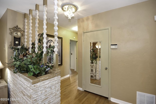 1199 N Halifax Ave, Daytona Beach, FL 32118 - foyer entrance with a chandelier and wood finished floors