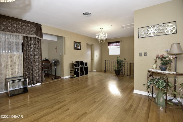 1199 N Halifax Ave, Daytona Beach, FL 32118 - living area with wood finished floors and a chandelier
