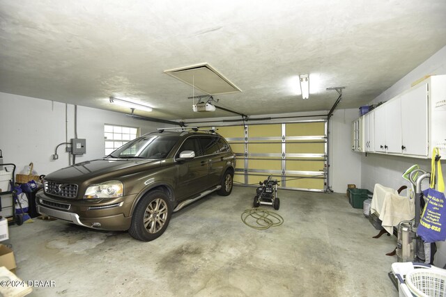 1199 N Halifax Ave, Daytona Beach, FL 32118 - garage featuring a garage door opener