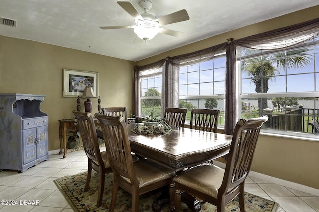 1199 N Halifax Ave, Daytona Beach, FL 32118 - dining room with light tile patterned floors and ceiling fan