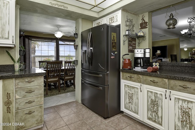 1199 N Halifax Ave, Daytona Beach, FL 32118 - kitchen with fridge with ice dispenser, light tile patterned floors, a ceiling fan, a chandelier, and tile countertops