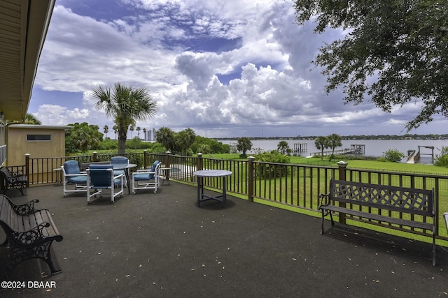 1199 N Halifax Ave, Daytona Beach, FL 32118 - view of patio with a water view and outdoor dining space