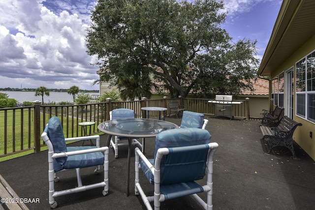 1199 N Halifax Ave, Daytona Beach, FL 32118 - view of patio with a water view and outdoor dining space