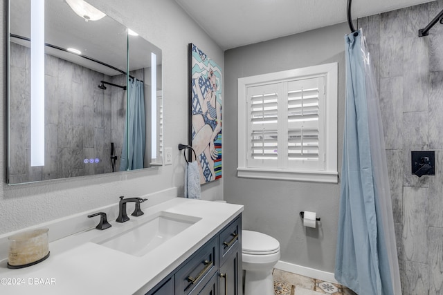 bathroom featuring toilet, vanity, and a shower with shower curtain