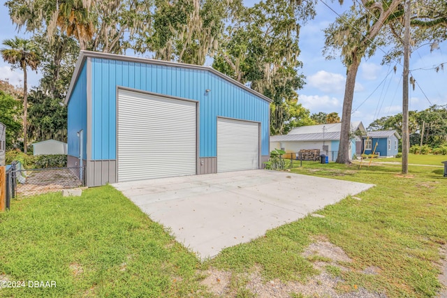 garage featuring a lawn