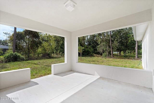 unfurnished sunroom with a wealth of natural light