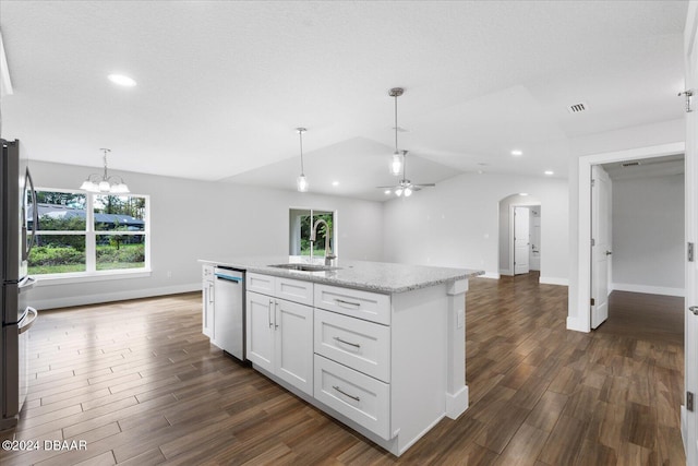 kitchen with white cabinetry, hanging light fixtures, dark wood-type flooring, lofted ceiling, and appliances with stainless steel finishes