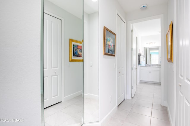 hallway with light tile patterned floors