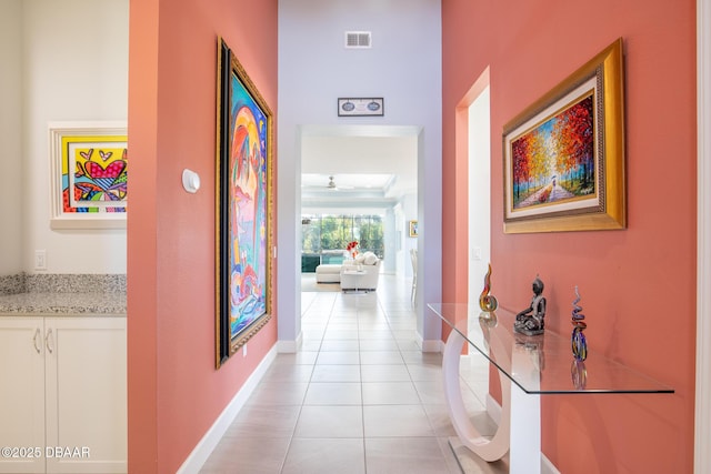 hallway featuring light tile patterned flooring