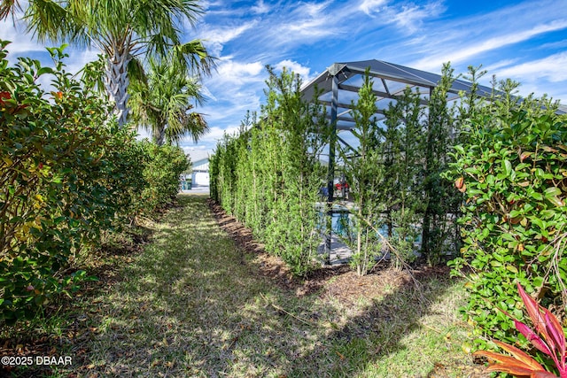 view of yard featuring a lanai