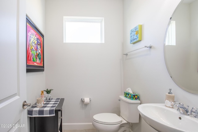 bathroom featuring sink and toilet