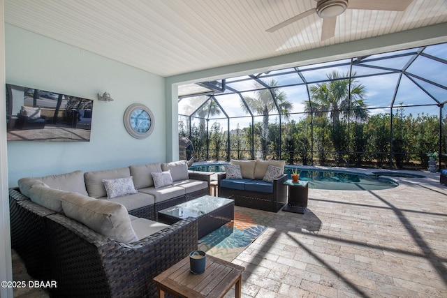 view of patio / terrace with an outdoor hangout area and glass enclosure