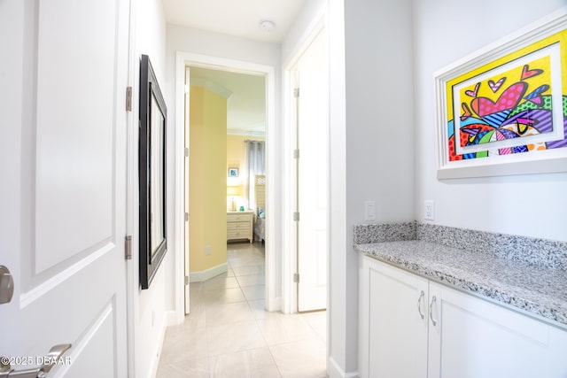 hallway with light tile patterned floors