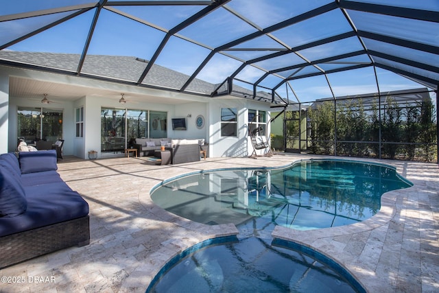 view of pool with a lanai, a patio area, outdoor lounge area, and ceiling fan