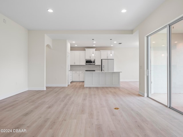 unfurnished living room with light wood-type flooring