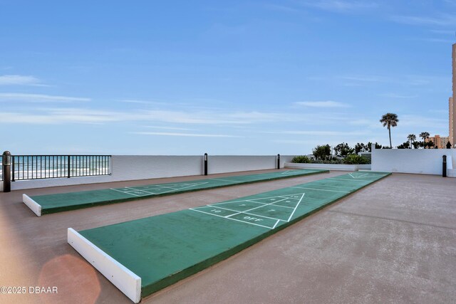 view of home's community featuring shuffleboard