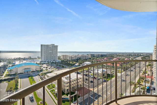 balcony featuring a view of city and a water view