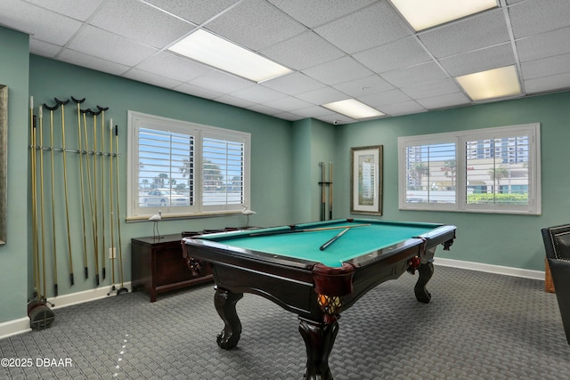 game room with carpet floors, a healthy amount of sunlight, and baseboards