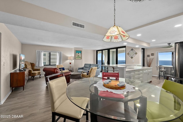 dining space featuring recessed lighting, baseboards, visible vents, and light wood finished floors