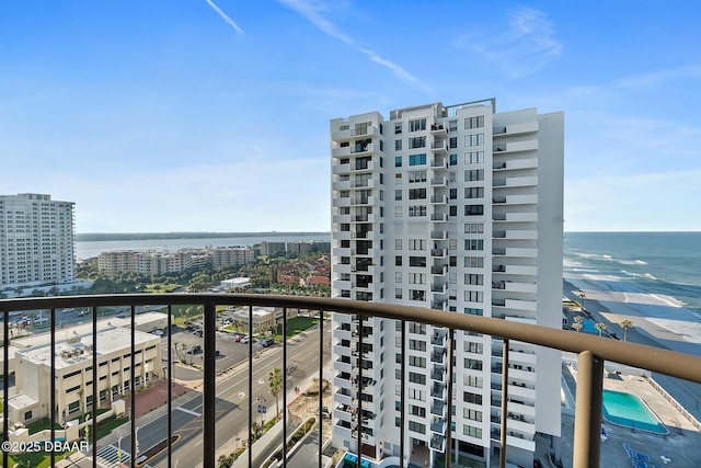 balcony featuring a city view and a water view