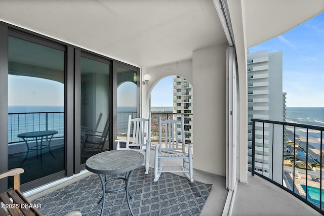 balcony featuring a water view