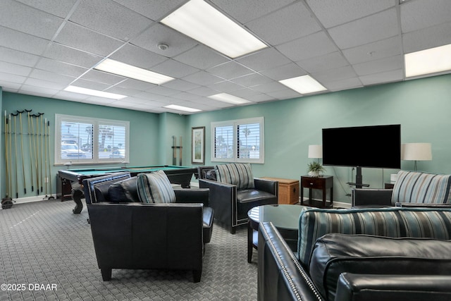 interior space featuring pool table, a healthy amount of sunlight, a paneled ceiling, and baseboards