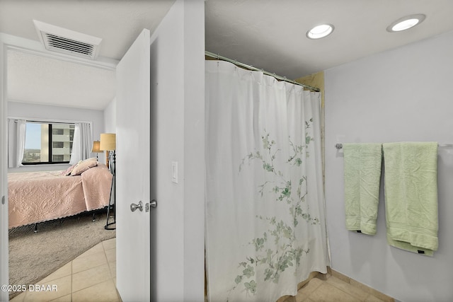 bathroom featuring ensuite bathroom, tile patterned flooring, recessed lighting, a shower with shower curtain, and visible vents