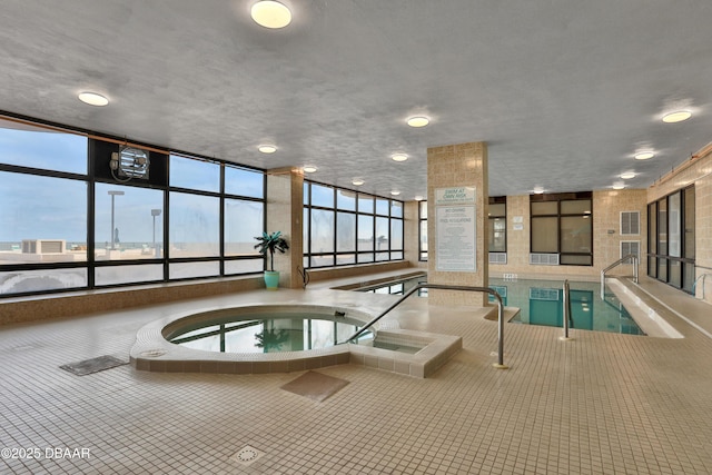 pool with an indoor in ground hot tub