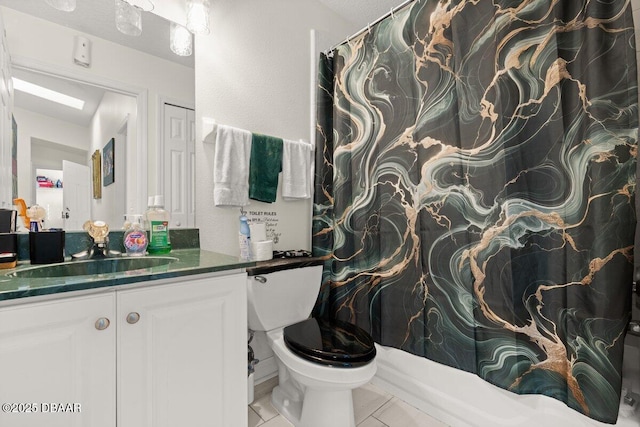 bathroom with vanity, tile patterned floors, and toilet