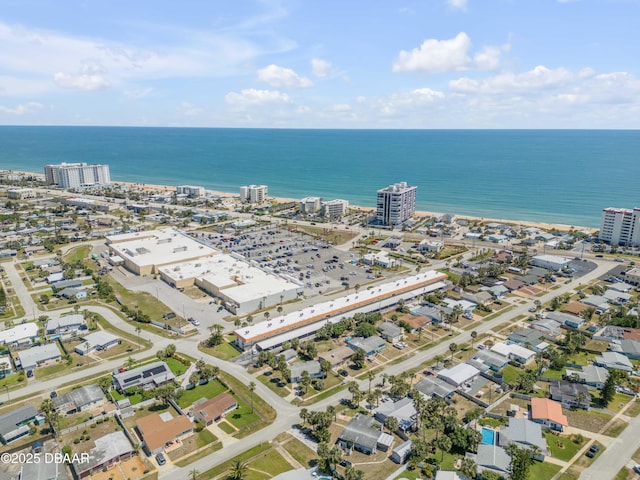 drone / aerial view featuring a water view and a view of city